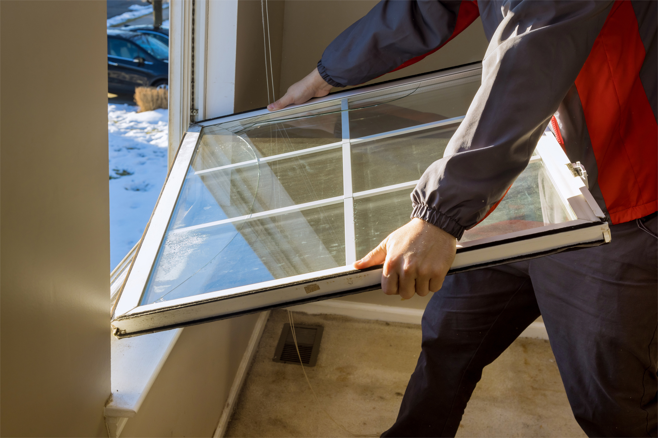 Worker in the removing break down windows in the home renovation living energy efficiency