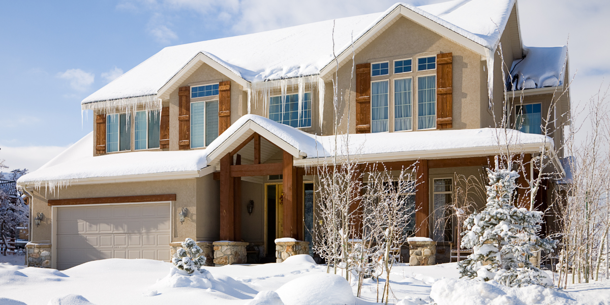 House exterior covered in snow and icicles