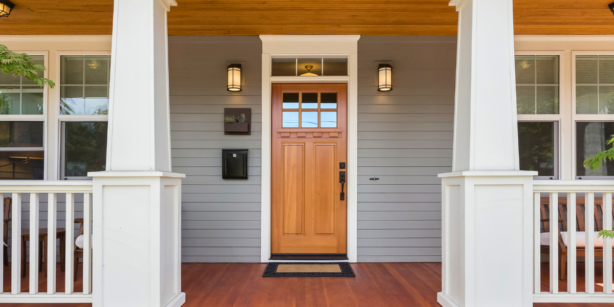Modern front door with light wood and window panes. 