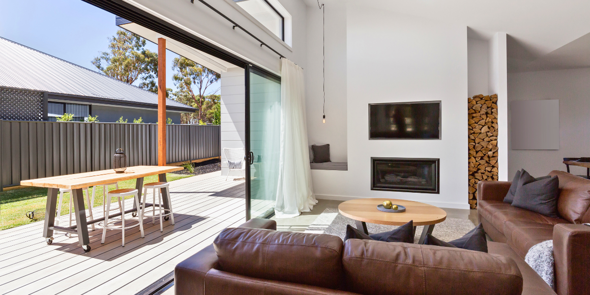 Large glass sliding patio doors open from patio to living room.