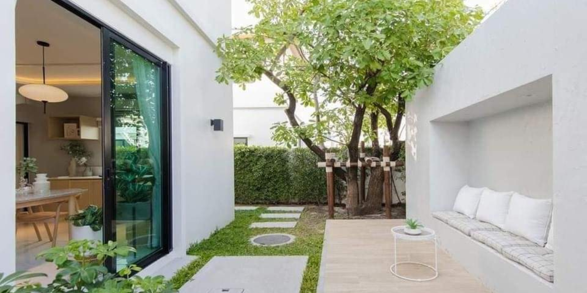 Large glass patio doors opened from living room to small courtyard.