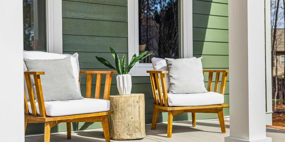 Decorative porch furniture and plants. 