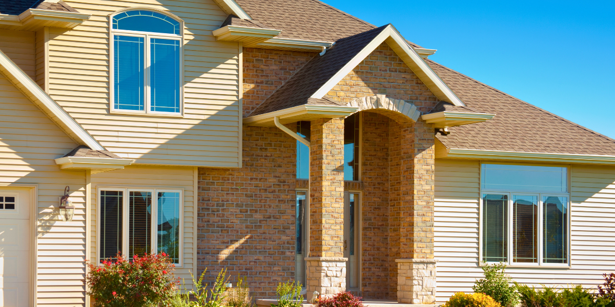 Modern vinyl and siding exterior of a house.