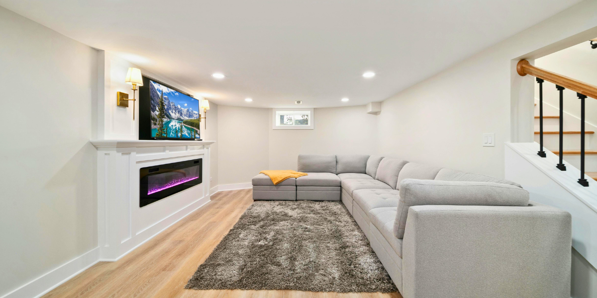 A well lit and bright basement with nicely placed windows.