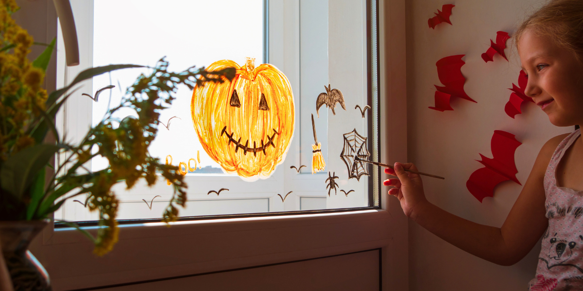 Halloween paintings on a window. 