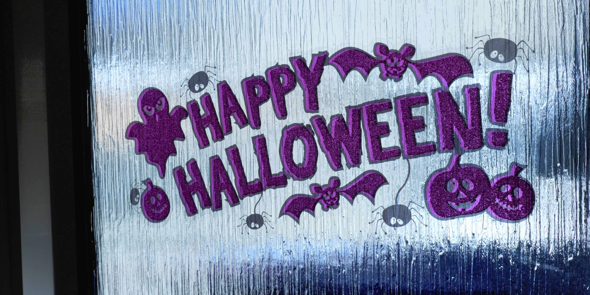 Happy Halloween sticker decal on a window. 