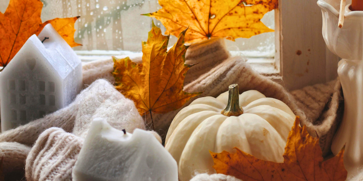 Pumpkins and October-themed windowsill decor. 